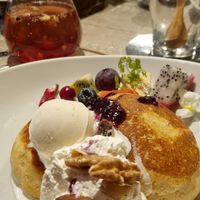 Fruit pancakes, with scoop of vanilla ice cream, whipped cream, fruit and fruit tea infusion at AIN SOPH.Journey in Kyoto