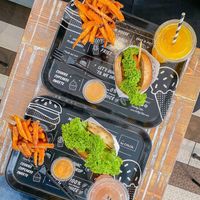 X2 guac burgers with sweet potato fries and homemade lemonade 🤩 at By Chloe - Covent Garden in London
