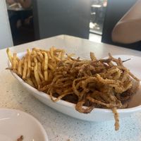 Fries and onion rings  at The Counter in Honolulu