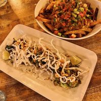 XO Broccoli and Butter Chicken Poutine  at MeeT in Yaletown in Vancouver