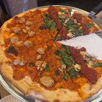 Vegan white pizza and vegan fungi pizza with homemade vegan cashew “mozzarella” spread instead of vegan cheese shreds. They have both options.   at Fine Folk Pizza in Fort Myers