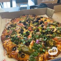 Vegan curry veggie pizza  at The Curry Pizza Company - Shaw Ave in Fresno