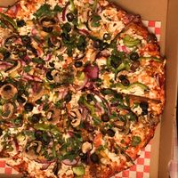 Veggie goddess pizza with vegan cheese  at The Curry Pizza Company - Shaw Ave in Fresno