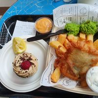 Fish and chips and raspberry tiramisu cupcake. at By Chloe - Tower Bridge in London