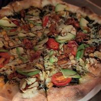 Vegan pizza with artichokes, chickpeas, avocado and balsamic glaze at Village Pantry in Hamilton