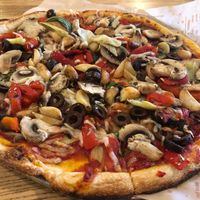 Load the veggies and a bit of vegan cheese at Blaze Pizza in Austin