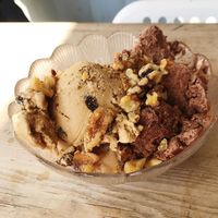 Rum and raisin plus chocolate fudge truffle ice cream topped with chopped walnuts  at Revival in Whitstable