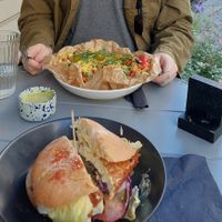 Crispy tofu burger (I cut it in half before the photo) and jackfruit nachos at Mazā Terapija in Riga