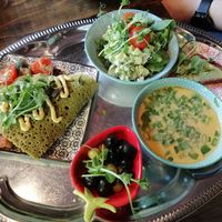 Buckwheat pancake, Tom kha soup with avocado bread, and salad at Mazā Terapija in Riga