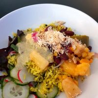 Red bean bowl with baked pineapple, bell peppers, corn, herbal rice and peanut sauce at Mazā Terapija in Riga