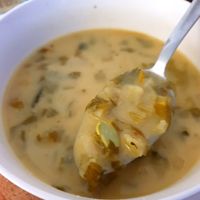 Creamy potatoes, yellow zucchini broth soup with edamame beans at Mazā Terapija in Riga