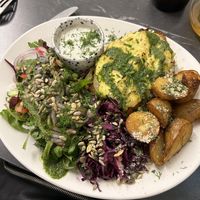 Huge portion of schnitzel with baked potato  at Mazā Terapija in Riga