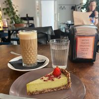 Avocado cake and cafe latte. at Mazā Terapija in Riga