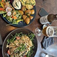 Chicken parma with potatoes and cream & truffle pasta  at Mazā Terapija in Riga