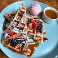 Belgian waffles with powdered sugar at Mazā Terapija in Riga