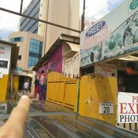 Follow this man to find the restaurant. at Preet Fast Food in Kigali