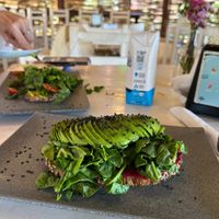 Toasted hummus sandwich with avocado, beetroot,hummus, cherry tomatoes, spinach on multigrain bread.   at Organi-K in Sayulita