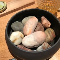 The two “Stones” in The middle are potatoes in a jacket of clay.  at Naturell in Ghent