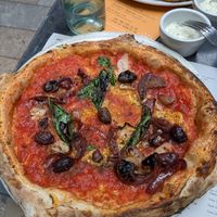 Marinara base with Kalamata olives and caramelized onions at Franco Manca in South West London