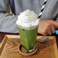 Matcha iced latte with oat milk and vegan creme at Ippuku Tea House in York