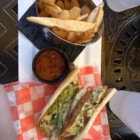 Chicken wrap with fries   at The Tilted Tiki in Stillwater