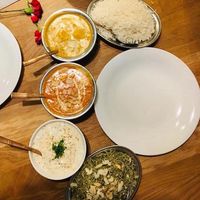 Indian Paneer, plain rice, curd raita, and mint rice at Bhajan Cafe in Krakow