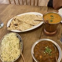Garlic naan daal chana masala and rice w spices  at Bhajan Cafe in Krakow