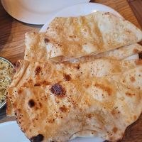 Garlic naan big enough to share at Bhajan Cafe in Krakow