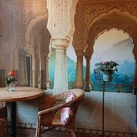 doubts about wall decorations and too small tables at Bhajan Cafe in Krakow