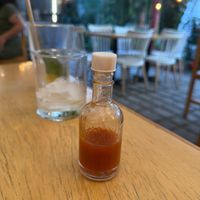 Delicious housemade hot sauce   at De La Llama in Quito