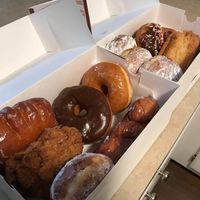 Dozen donuts. Cinnamon twist is a personal fav! at Donut Palace in Portland