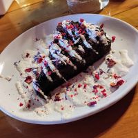 Vegan blueberry chocolate cake with cashew creme, was a bit bland, needed more sweetness and texture! at Polpetta in New Plymouth