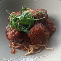 Tofu, teriyaki and rice balls on spaghetti with pomodoro sauce at Polpetta in New Plymouth