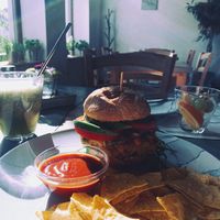 Burger with pea patty, chips, salsa at Roots in Trencin