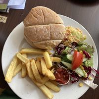 Burger, chips, salad, coleslaw and relish.  at The White Hart in Cheddar