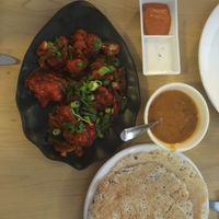 Cauliflower manchurian and kallappam (pancake made from fermented rice and coconut milk batter). at Kathakali in New Plymouth