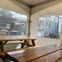 Heated covered seating area at Dingers Deli - Food Cart in Portland