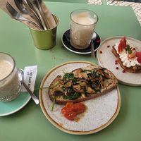 Toast with mushrooms, spinach, and hummus and chai lattes (also pictured is gf carrot cake that is not vegan) at Nicolau Lisboa in Lisbon