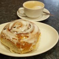 Oat latte and a bun at Coughlans Bakery - Reigate in Reigate