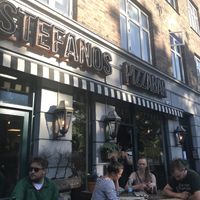 Outdoor seating in the cool area of Stefansgade  at Stefanos Pizzabar in Copenhagen