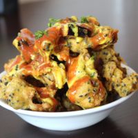 Crispy pakoras in onion seed batter  at Amrutha Lounge - Earlsfield in South West London