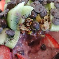 Acaí bowl topped with strawberries, kiwi, and dark chocolate chips at The Otter Juice Co in Hays