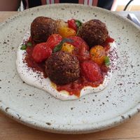 Chaud-froid de tomates cerises, boulettes de quinoa à l'origan, labneh végétal au citron at Les Mauvaises Herbes in Lyon