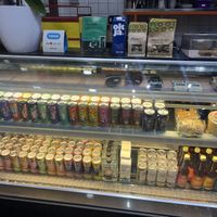 Front counter with array of drinks, takeout meals and sweets  at The Fussy Vegan - Blairgowrie in Johannesburg