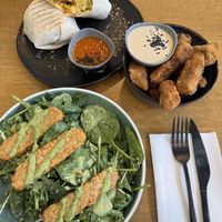 Breakfast burrito, eggplant chips, and the greens and grains salad. Delightful!   at Dicki's in New Farm