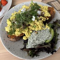Scrambled tofu and avocado on toast with a tomato and basil sauce? And vegan feta  at Jord in Malmo