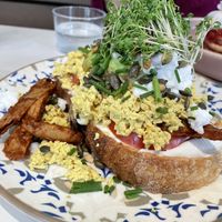 Scrambled tofu on sourdough bread with oumph, cream cheese and feta cheese 🤯  at Jord in Malmo