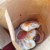 Vegan pastries in paper takeaway at Bageri Leve in Malmo