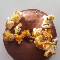 Friday donut with chocolate glaze and candied popcorn at Bageri Leve in Malmo