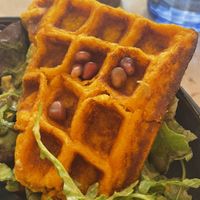 Gaufres de patates douce au lait de coco, guacamole é salade verte.  at Riz Riz - Marais in Paris